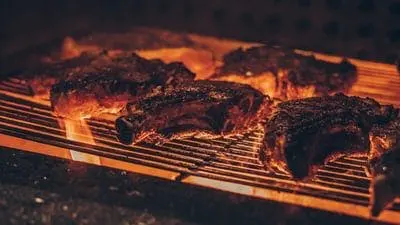 Steaks on the grill at 8th Street Steakhouse